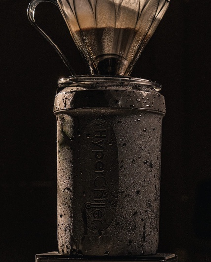 Coffee dripping through a V60 into a frosted HyperChiller