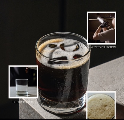 A glass of Shaken Cold Brew with a light foam on top